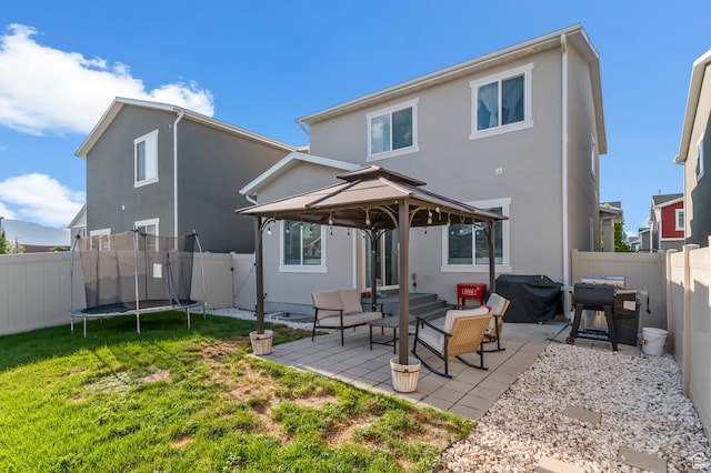 5631 W Still Well Ln S, Herriman, UT 84096 - back of house with a gazebo, stucco siding, and a fenced backyard