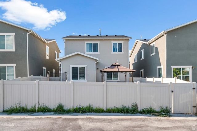 5631 W Still Well Ln S, Herriman, UT 84096 - rear view of property featuring a gazebo, stucco siding, and a gate