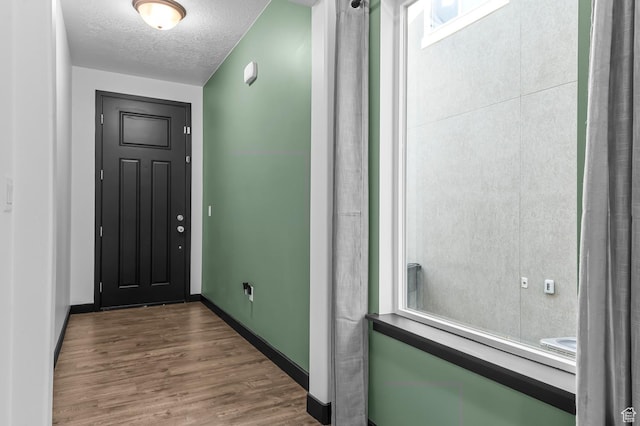 5631 W Still Well Ln S, Herriman, UT 84096 - doorway to outside with wood finished floors and a textured ceiling