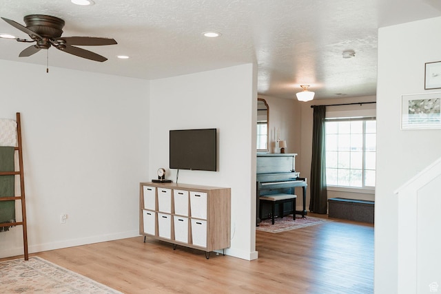279 S 950 W, Spanish Fork, UT 84660 - living area featuring wood finished floors, ceiling fan, recessed lighting, and a textured ceiling