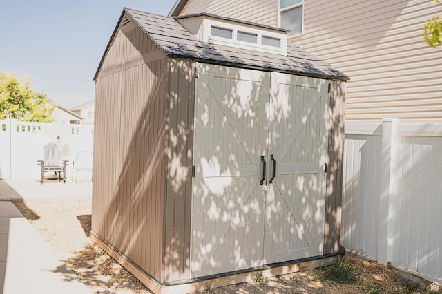 279 S 950 W, Spanish Fork, UT 84660 - view of side of home with a shed, a fenced backyard, and a shingled roof