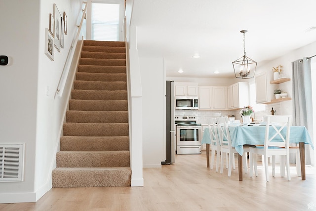 279 S 950 W, Spanish Fork, UT 84660 - dining space with stairway, light wood-type flooring, and recessed lighting