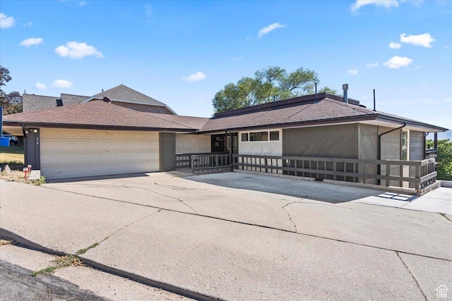 96 S 1000 W, Orem, UT 84058 - view of front of house featuring a garage, driveway, and roof with shingles