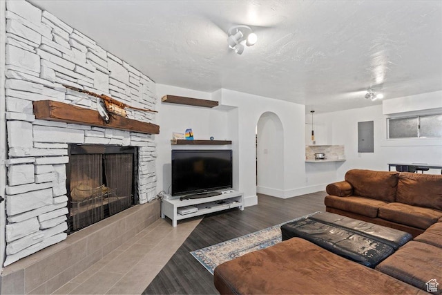 96 S 1000 W, Orem, UT 84058 - living room with electric panel, a fireplace, and arched walkways