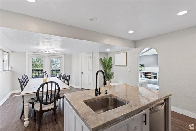 96 S 1000 W, Orem, UT 84058 - kitchen featuring dark wood-style flooring, arched walkways, a kitchen island with sink, recessed lighting, and stainless steel dishwasher