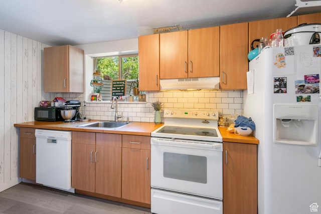 249 N 800 W, Orem, UT 84057 - kitchen featuring white appliances, under cabinet range hood, light countertops, tasteful backsplash, and wood walls
