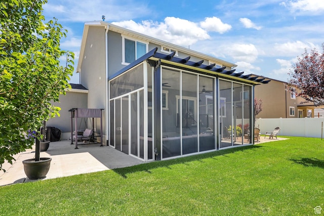 1098 S 4050 W, Syracuse, UT 84075 - rear view of property with a sunroom, a patio, and stucco siding