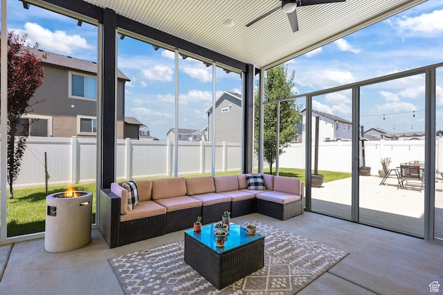 1098 S 4050 W, Syracuse, UT 84075 - sunroom featuring ceiling fan, a residential view, and an outdoor living space with a fire pit