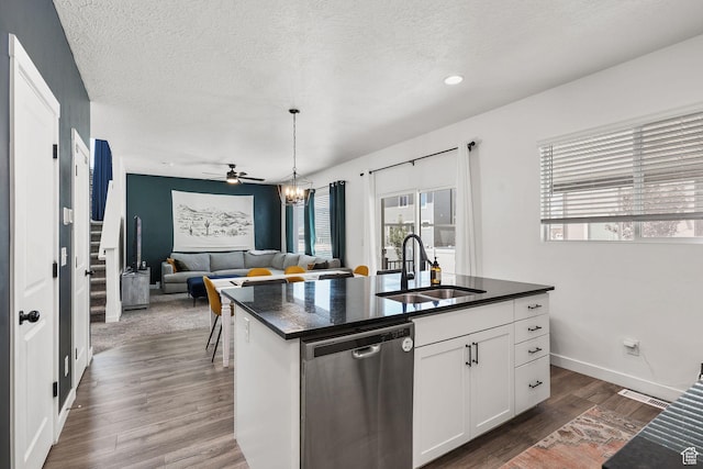 1098 S 4050 W, Syracuse, UT 84075 - kitchen with stainless steel dishwasher, dark wood-type flooring, a textured ceiling, white cabinets, and an island with sink