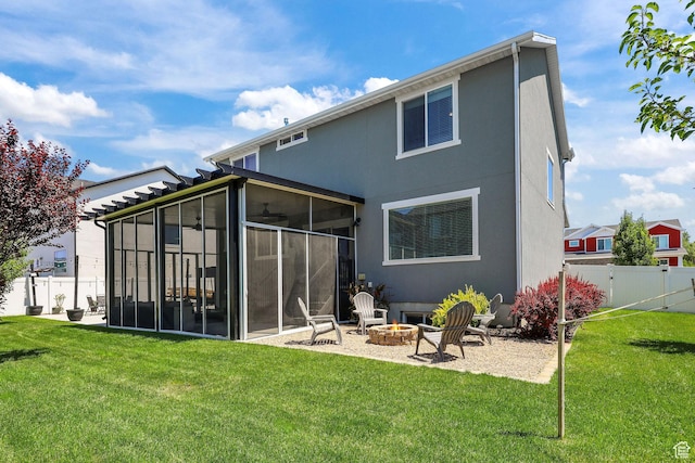 1098 S 4050 W, Syracuse, UT 84075 - back of property with a sunroom, an outdoor fire pit, and stucco siding