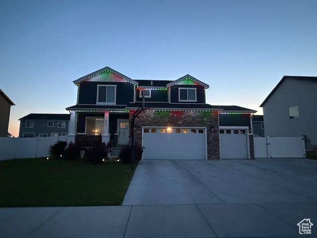 1098 S 4050 W, Syracuse, UT 84075 - victorian-style house featuring an attached garage, driveway, and stone siding