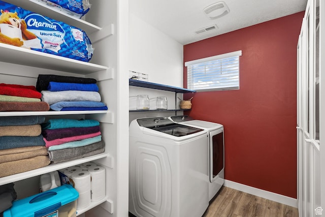 1098 S 4050 W, Syracuse, UT 84075 - laundry area with wood finished floors and separate washer and dryer