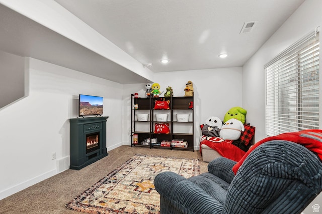 1098 S 4050 W, Syracuse, UT 84075 - living room with carpet, a warm lit fireplace, and recessed lighting