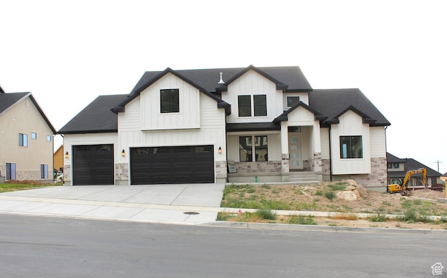 1318 S 1090 E, Salem, UT 84653 - view of front facade with board and batten siding, a porch, concrete driveway, an attached garage, and roof with shingles