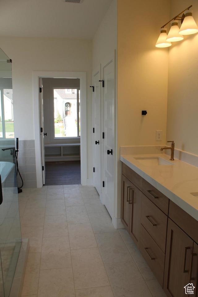 1318 S 1090 E, Salem, UT 84653 - full bathroom featuring double vanity, a freestanding tub, and tile patterned flooring
