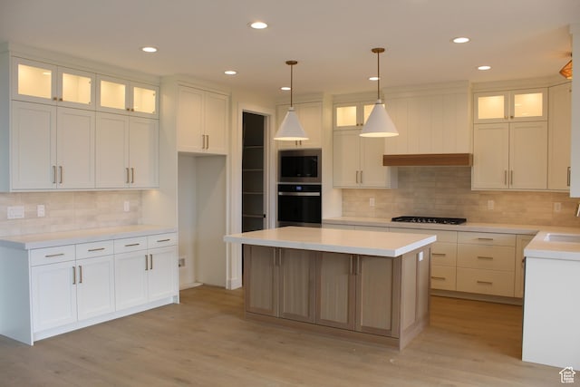 1318 S 1090 E, Salem, UT 84653 - kitchen featuring oven, stainless steel microwave, light wood-style floors, tasteful backsplash, and recessed lighting