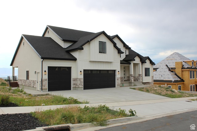 1318 S 1090 E, Salem, UT 84653 - modern farmhouse style home featuring stone siding, concrete driveway, an attached garage, and board and batten siding