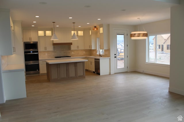 1318 S 1090 E, Salem, UT 84653 - kitchen with stainless steel appliances, light countertops, glass insert cabinets, tasteful backsplash, and a center island