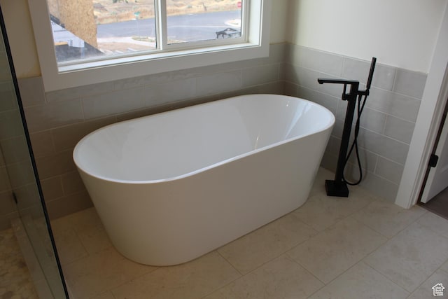 1318 S 1090 E, Salem, UT 84653 - full bathroom with tile walls, a soaking tub, tile patterned floors, and wainscoting