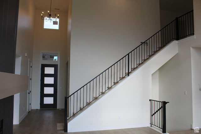 1318 S 1090 E, Salem, UT 84653 - entrance foyer featuring a high ceiling, a chandelier, wood finished floors, and stairs