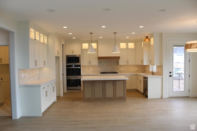 1318 S 1090 E, Salem, UT 84653 - kitchen with appliances with stainless steel finishes, light countertops, light wood-type flooring, tasteful backsplash, and recessed lighting