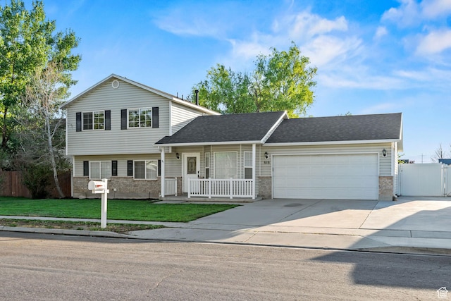 616 S 1430 W, Lehi, UT 84043 - view of front of property with brick siding, driveway, an attached garage, covered porch, and a shingled roof