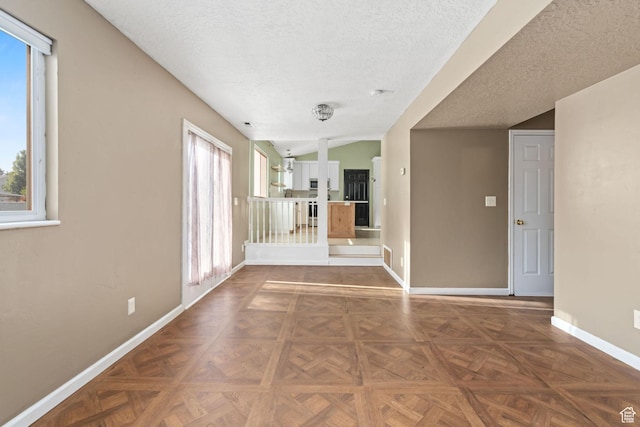 616 S 1430 W, Lehi, UT 84043 - unfurnished living room featuring plenty of natural light and a textured ceiling