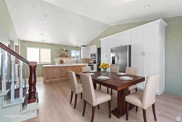 616 S 1430 W, Lehi, UT 84043 - dining area featuring light wood-style flooring, lofted ceiling, recessed lighting, and stairs