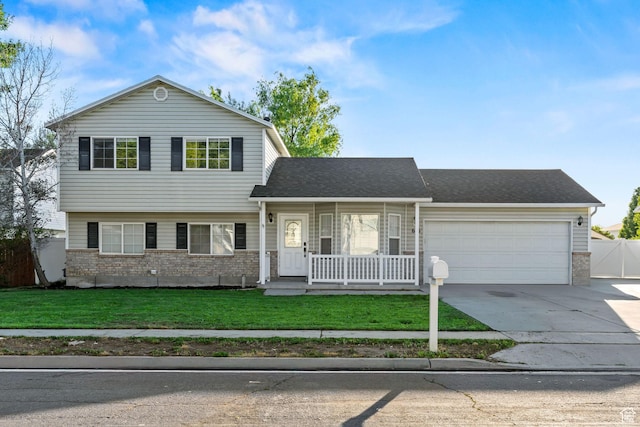 616 S 1430 W, Lehi, UT 84043 - view of front of house featuring brick siding, a garage, covered porch, and driveway