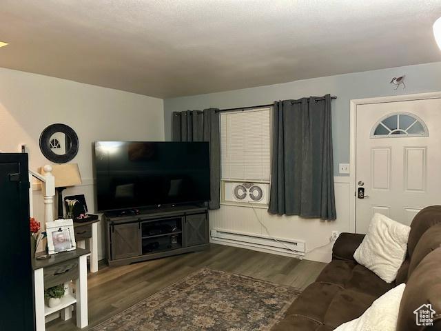 1200 N 100 W Unit 40, Vernal, UT 84078 - living area with a baseboard heating unit and wood finished floors
