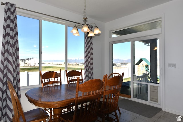 4666 W Olympic Wood Ct, West Jordan, UT 84084 - tiled dining space featuring a chandelier and a water view