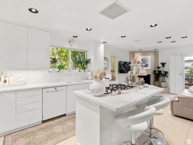 4506 S Gilead Way E, Millcreek, UT 84124 - kitchen featuring dishwasher, open floor plan, a kitchen island, light tile patterned floors, and recessed lighting