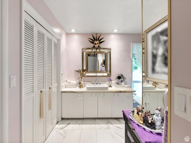 4506 S Gilead Way E, Millcreek, UT 84124 - bathroom with a closet, vanity, recessed lighting, and marble look tiles