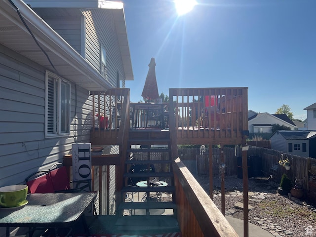 4106 W 4875 S, Roy, UT 84067 - wooden terrace featuring a fenced backyard and a playground