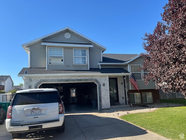 4106 W 4875 S, Roy, UT 84067 - view of front facade featuring a garage, driveway, a front lawn, and roof with shingles