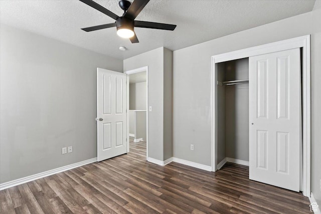 729 N Buckingham Dr W, North Salt Lake, UT 84054 - unfurnished bedroom featuring dark wood-style flooring, a closet, a textured ceiling, and ceiling fan
