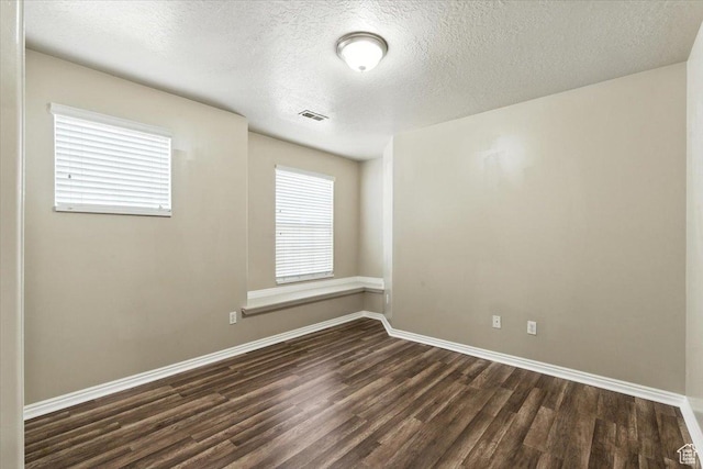 729 N Buckingham Dr W, North Salt Lake, UT 84054 - empty room featuring dark wood-type flooring and a textured ceiling