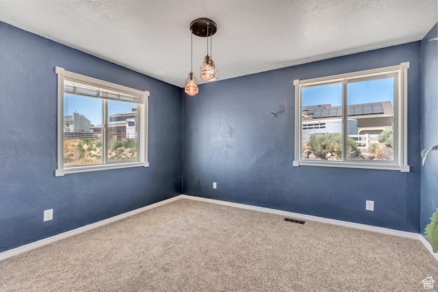 9517 N Shiloh Way E, Eagle Mountain, UT 84005 - empty room featuring carpet floors and healthy amount of natural light