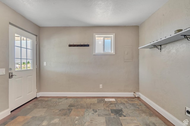 9517 N Shiloh Way E, Eagle Mountain, UT 84005 - entryway featuring stone finish flooring and electric panel