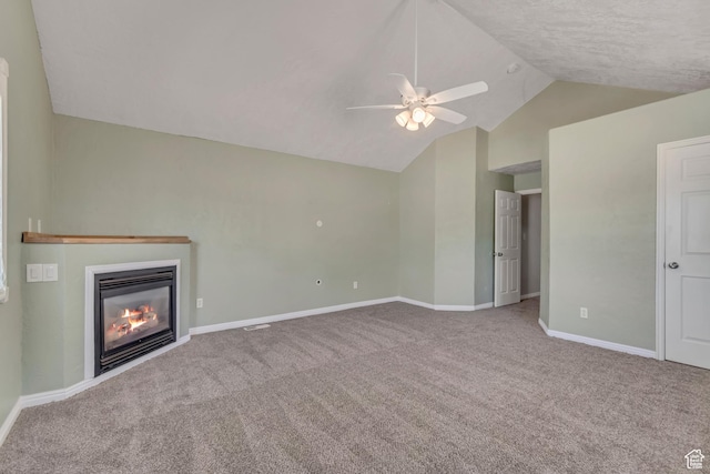 9517 N Shiloh Way E, Eagle Mountain, UT 84005 - unfurnished living room featuring vaulted ceiling, a ceiling fan, carpet floors, and a glass covered fireplace