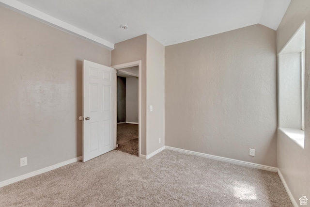 9517 N Shiloh Way E, Eagle Mountain, UT 84005 - carpeted empty room with vaulted ceiling and baseboards