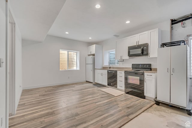 9517 N Shiloh Way E, Eagle Mountain, UT 84005 - kitchen featuring black appliances, white cabinets, recessed lighting, light wood finished floors, and light countertops