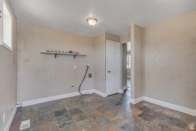 9517 N Shiloh Way E, Eagle Mountain, UT 84005 - unfurnished room with baseboards and stone finish floors