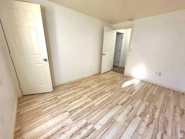 2592 W 2650 N, Clinton, UT 84015 - unfurnished bedroom with light wood-type flooring and baseboards