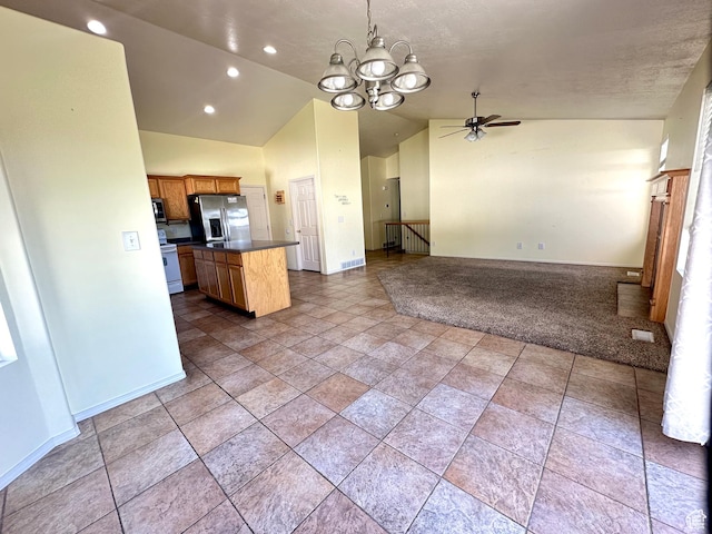 2592 W 2650 N, Clinton, UT 84015 - kitchen featuring stainless steel appliances, open floor plan, dark countertops, vaulted ceiling, and a chandelier