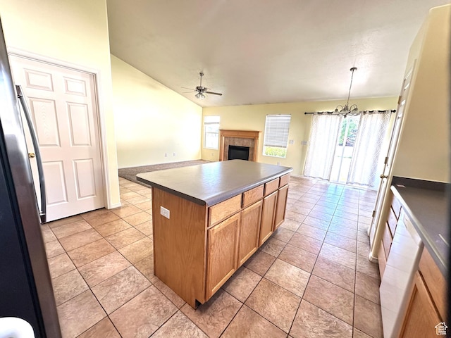 2592 W 2650 N, Clinton, UT 84015 - kitchen with ceiling fan, a center island, a fireplace, vaulted ceiling, and open floor plan