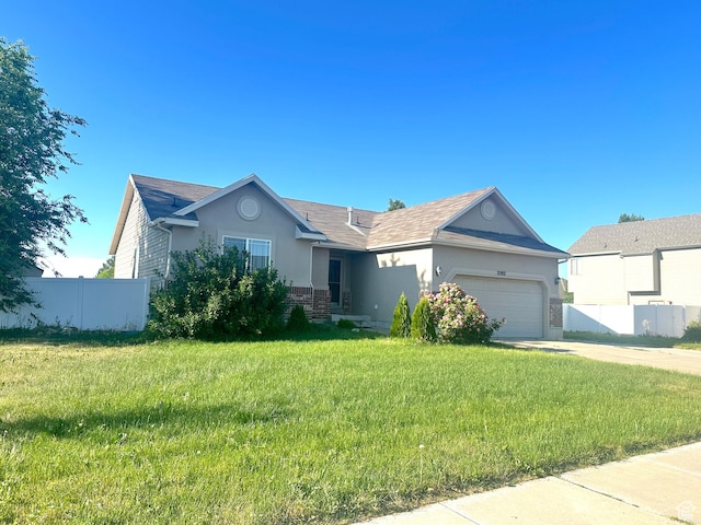 2592 W 2650 N, Clinton, UT 84015 - single story home featuring stucco siding, a garage, driveway, and roof with shingles