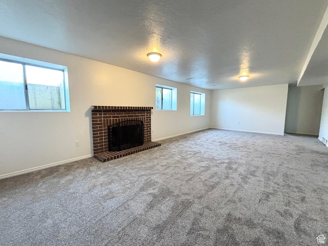 7692 S Chad St, Midvale, UT 84047 - unfurnished living room featuring carpet and a brick fireplace