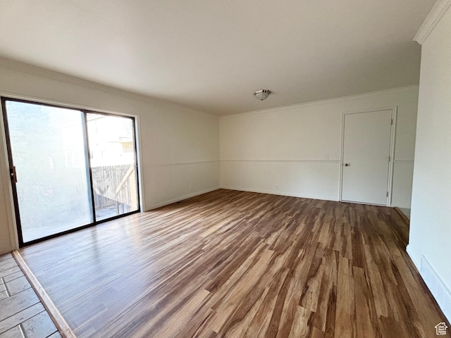 7692 S Chad St, Midvale, UT 84047 - spare room featuring wood finished floors and crown molding