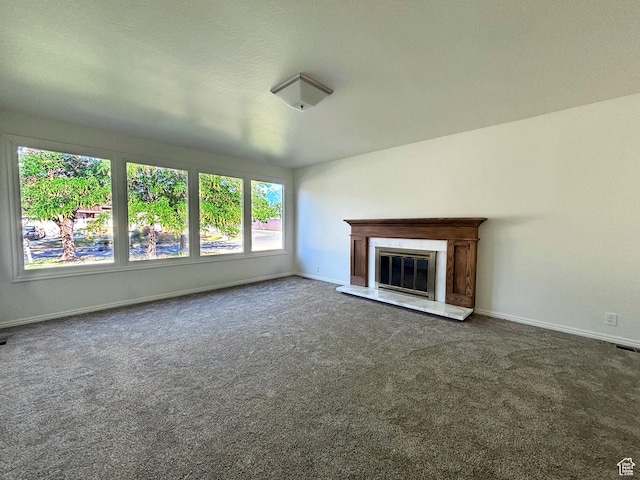 7692 S Chad St, Midvale, UT 84047 - unfurnished living room with carpet flooring and a premium fireplace